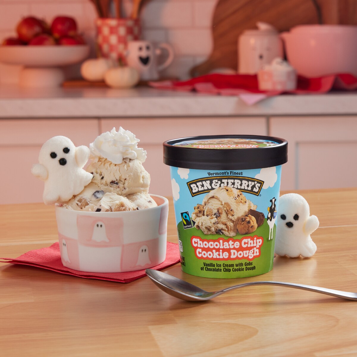 Pint of Ben & Jerry's Chocolate Chip Cookie Dough ice cream next to a sundae topped with a white ghost.